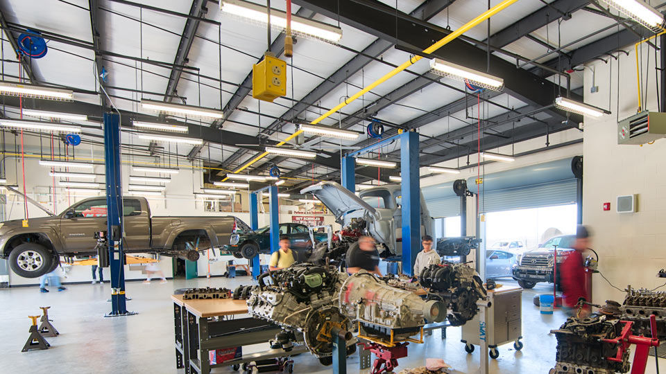 Automotive shop with standard deck over steel beams