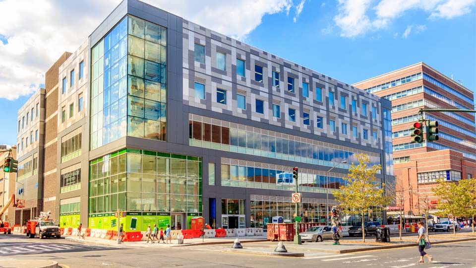 Corner street view of multi-story retail building