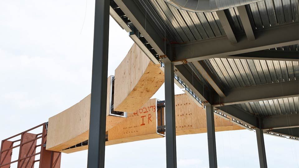 View of special profile joist from under signage and deck overhang