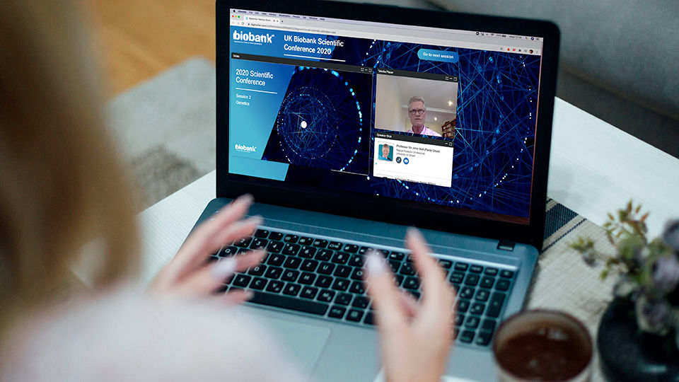 Over the shoulder view of someone looking at the BioBank website on a laptop