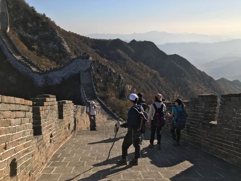 group of people hiking the wild great wall