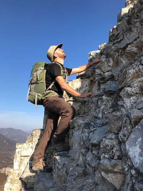 person climbing the wild great wall