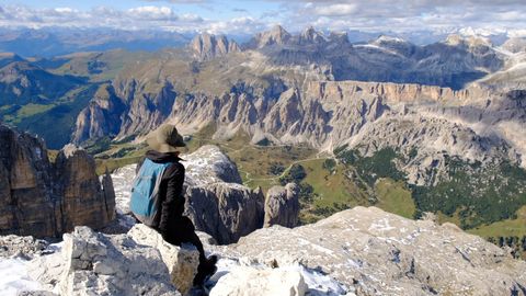 man sitting on a cliff