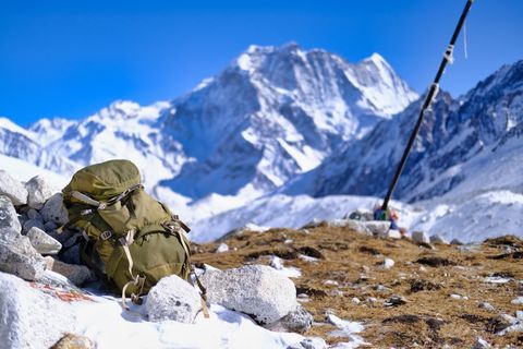 backpack laying in snow