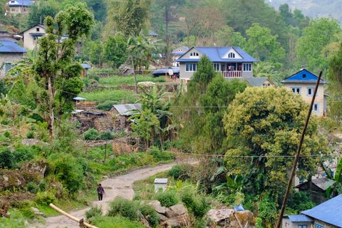 rural village houses nestled green mountains