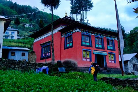 traditional red monastery building rural nepal
