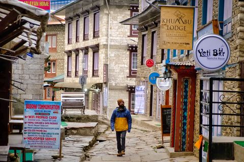 backpacker walking in namche bazaar