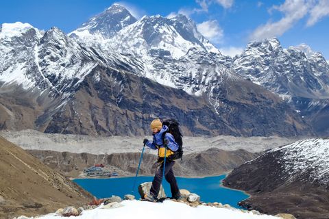 hiker above gokyo lake and everest