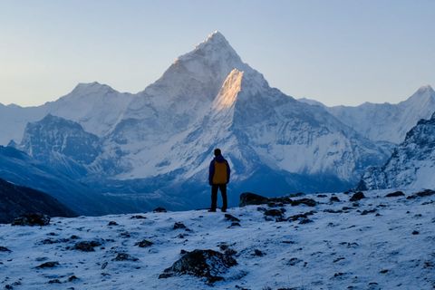 hiker ama dablam at sunrise