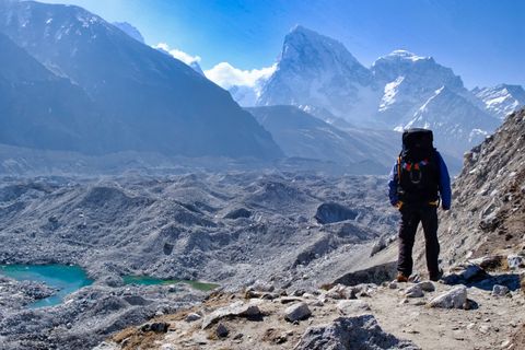 hiker crossing glacier