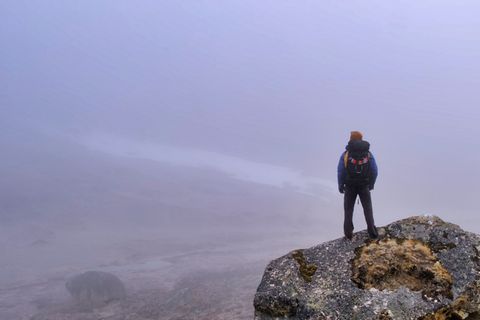 hiker in foggy kongma pass