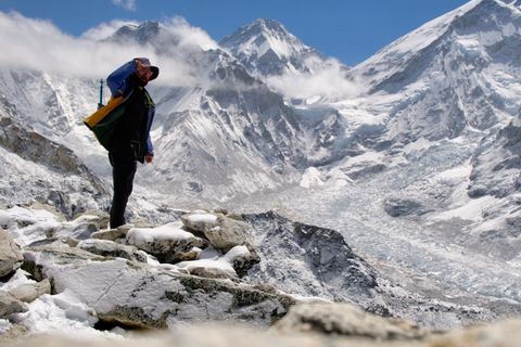 hiker summiting kala patthar