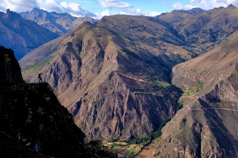 hiker silhouette overlooking valley