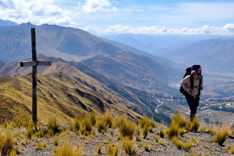 hiker summiting mount katunki