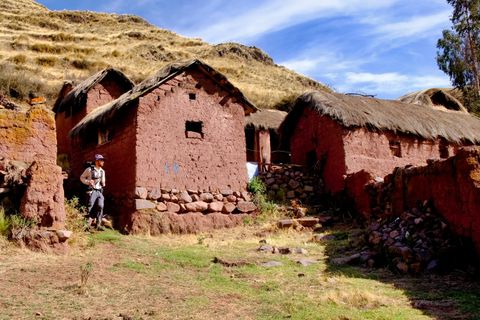 hiker walking through adobe village