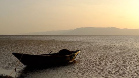 fisherman boat during sunset