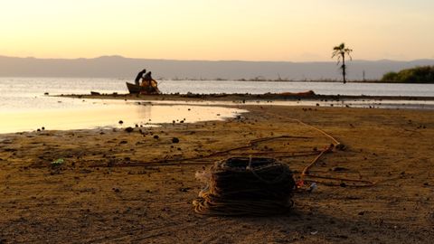 fisherman pulling fishing rope