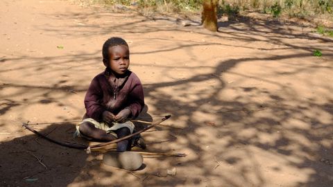 hadzabe tribe child with bow