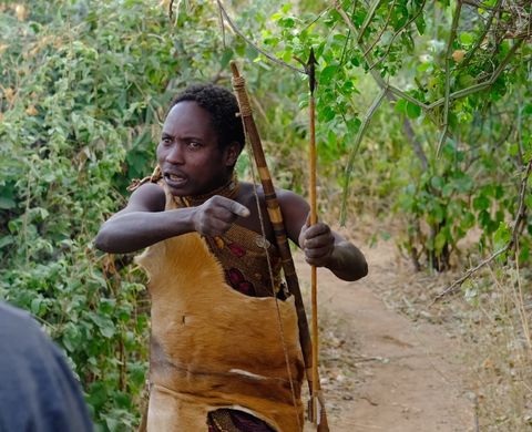 hadzabe tribe member with bow