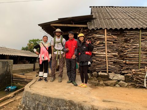 four people in trekking guides home