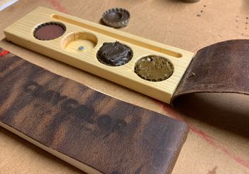 <p>The clay color palette is made from recycled materials: Spare wood, beer bottle caps, cigarette paper magnets and leather from old boots</p>