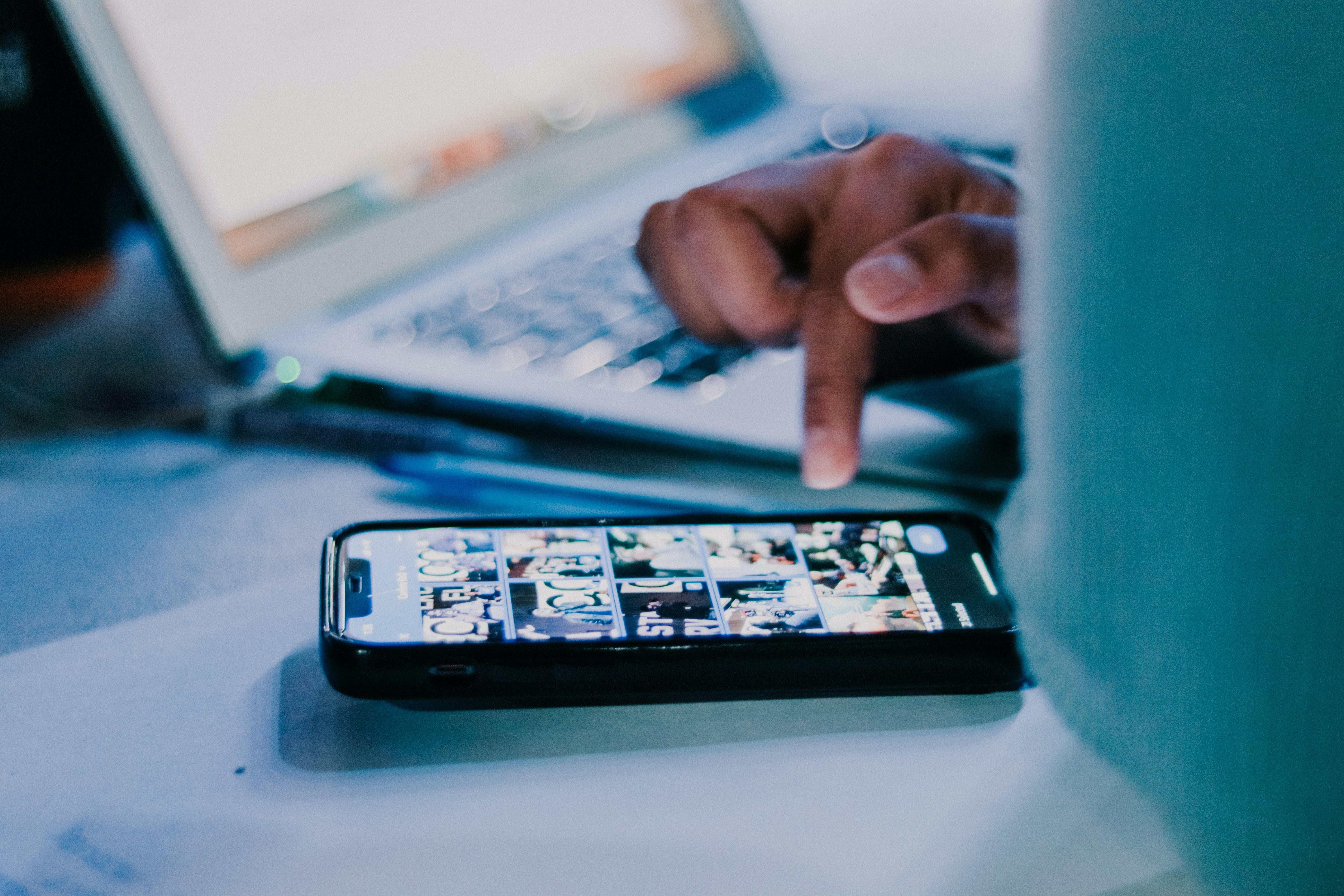 person scrolling through their mobile device