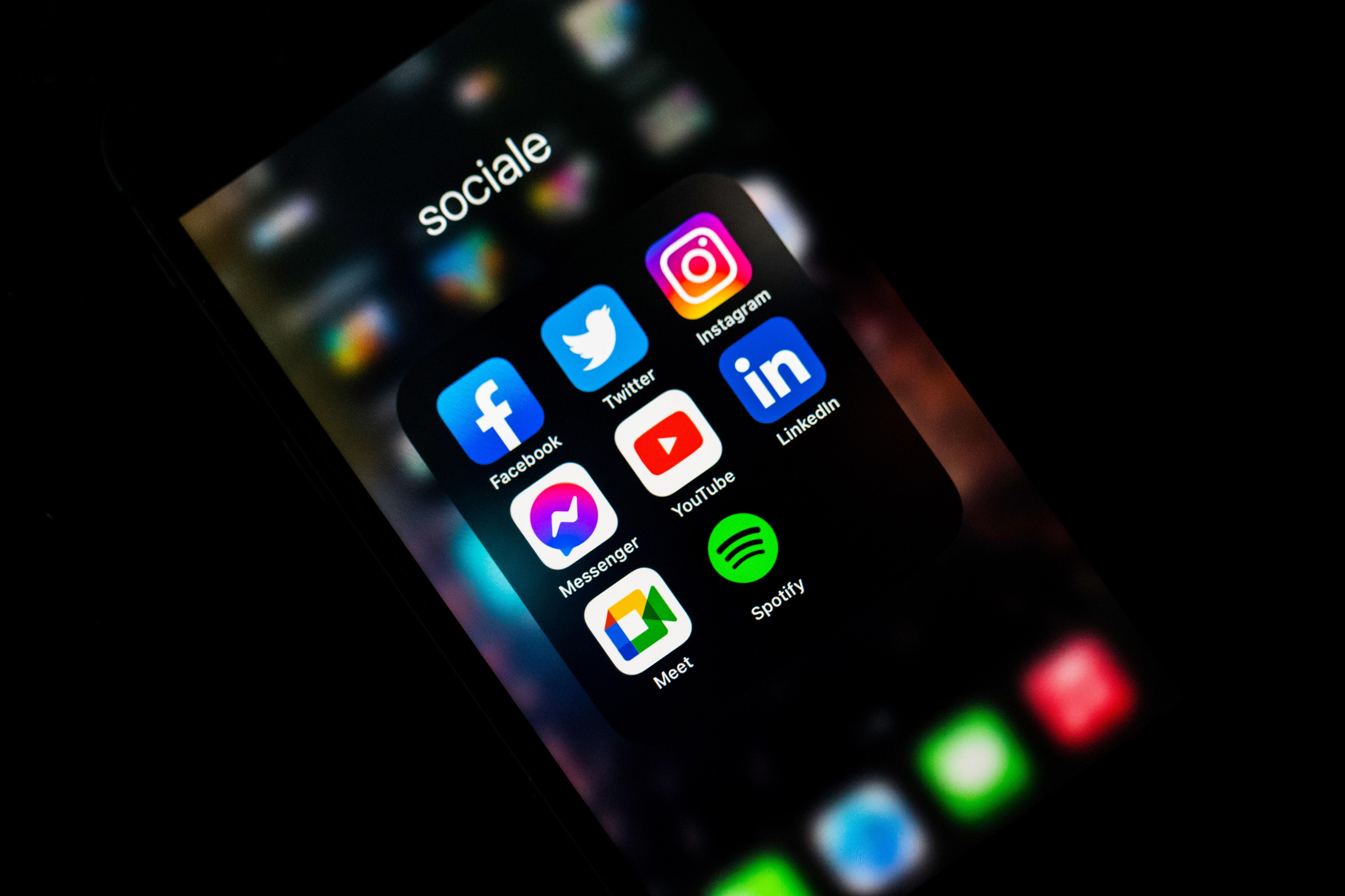 mobile phone with various social media platform app icons