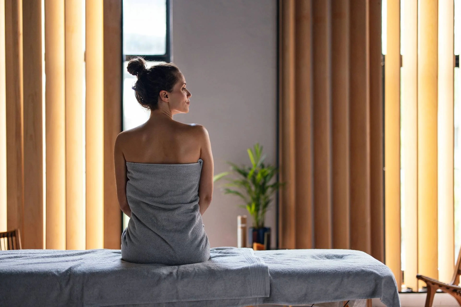 What Happens to Your Body After a Massage? What Happens to Your Body After a Massage? - BeautifulWomanSittingontheMassageBedattheSpa 1