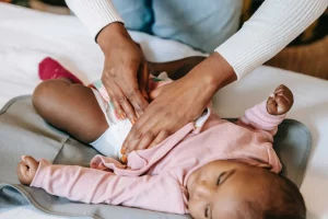 Massage for Kids: Benefits and Considerations Massage-therapist-doing-massage-or-little-lack-girl