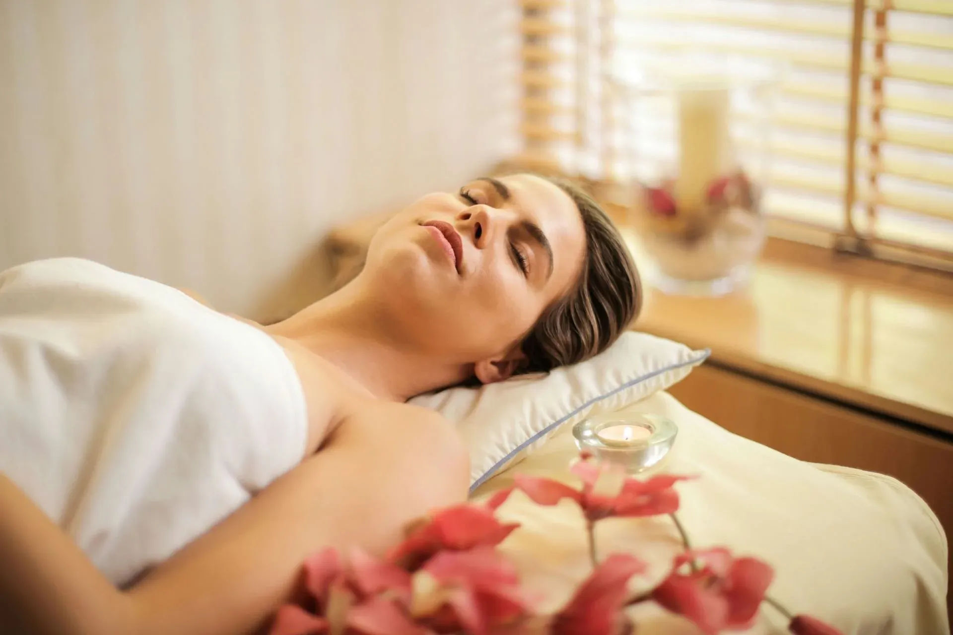 Massage and Energy Healing: Balancing the Chakras Woman in Wrapped in White Towel