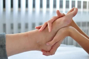 massaging-a-foot-with-two-hands