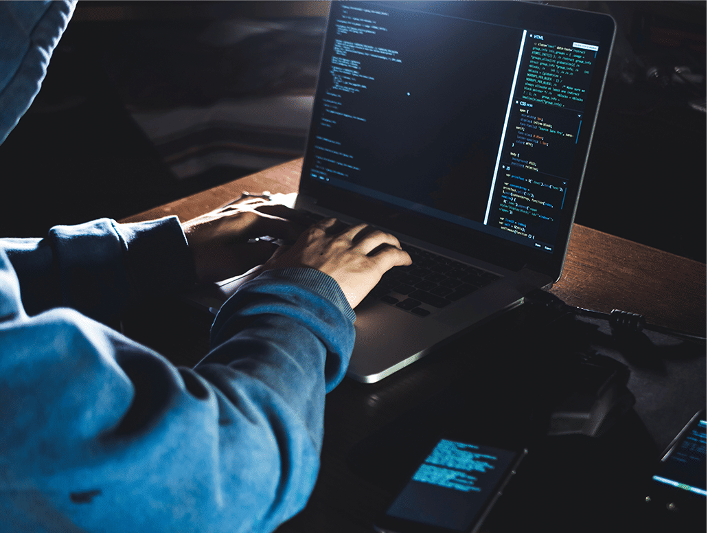 Business colleagues reviewing endpoint security solutions | Qualys