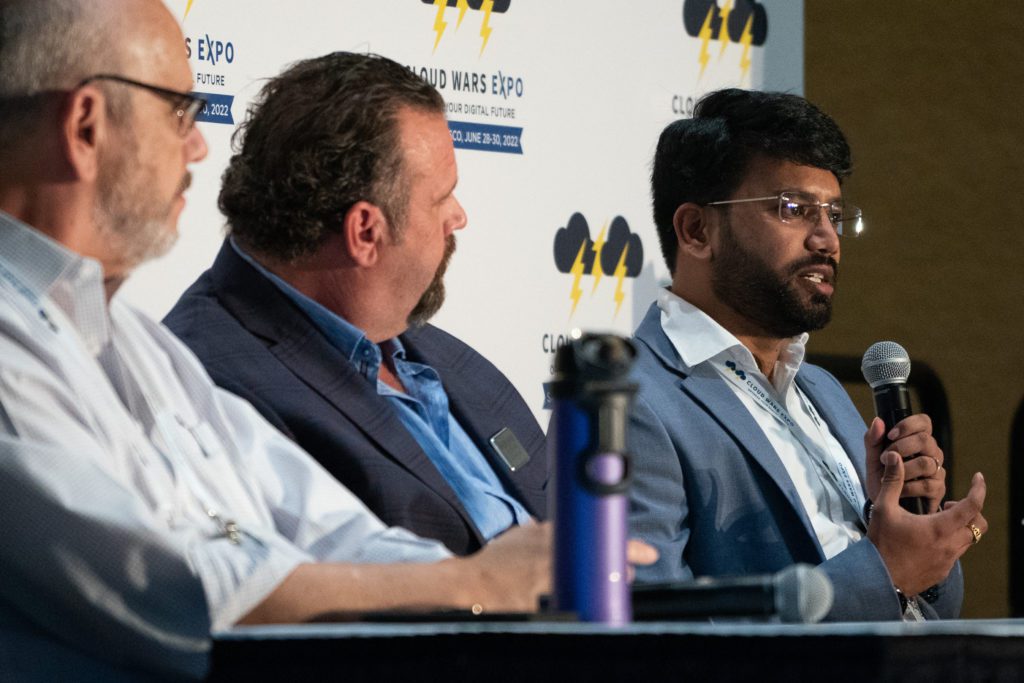 Ronak Mathur (right) speaks on a panel accompanied by fellow Acceleration Economy analyst Wayne Sadin (left) and Dynamic Communities' Chief Data Strategist John Muehling (center).