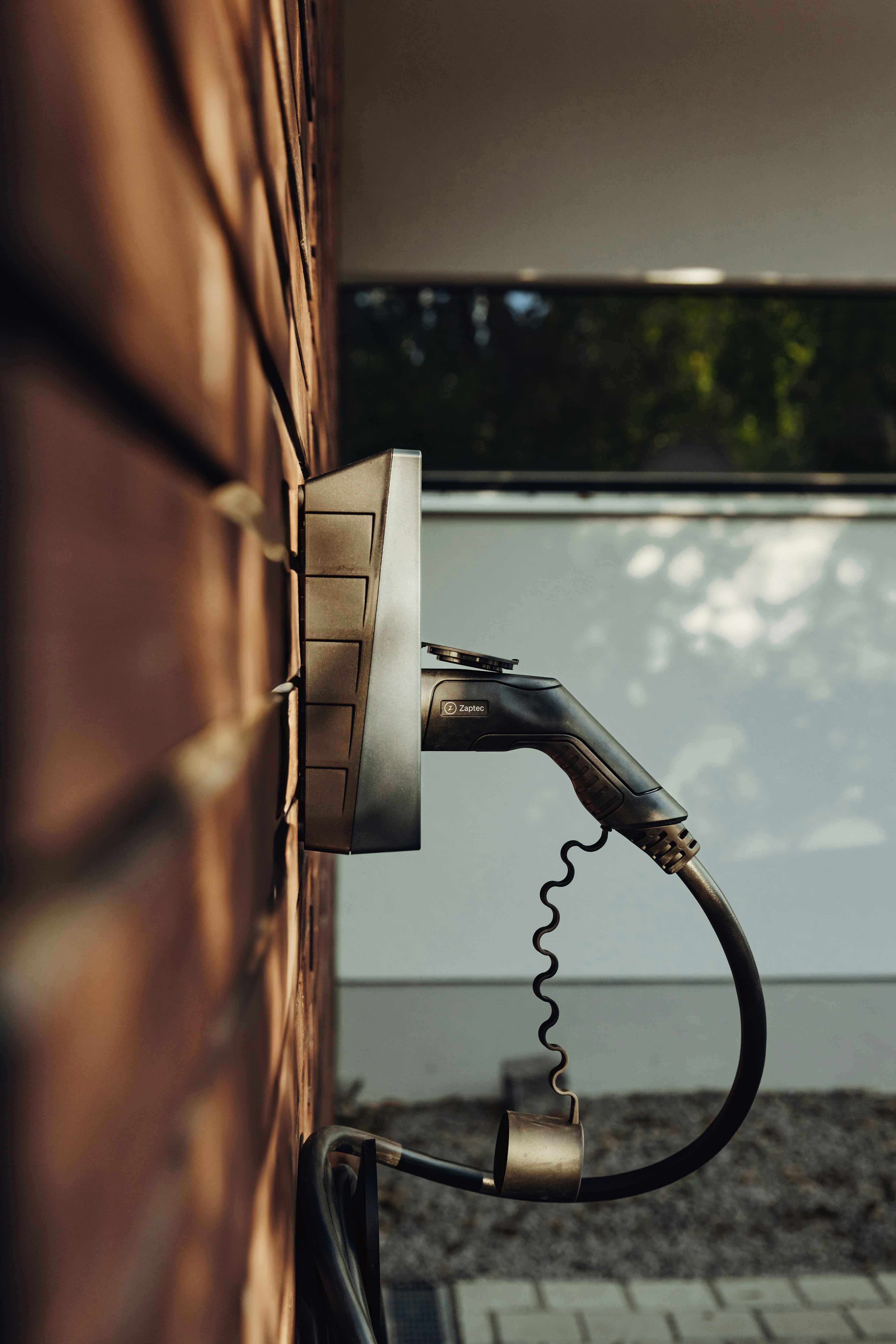 A close-up of the charging plug on a finished home EV charger install