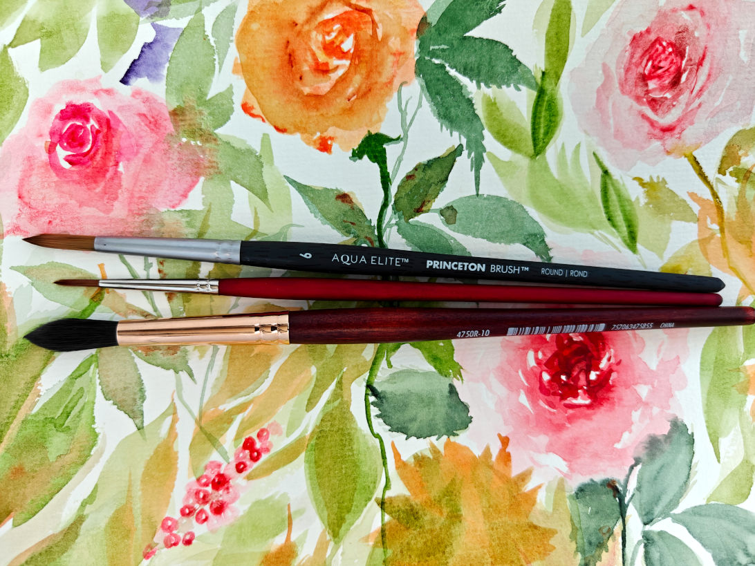 Three essential watercolor brushes for beginners: small detail round, medium round, and large mop brush