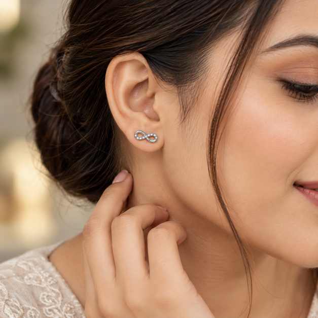 Silver Infinity Design Stud Earrings With Clear Stone Detailing - STOP11026 side view