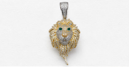 Gold Plated Sterling Silver Lion Head Pendant with CZ Stones & Green Stone Eyes close-up view