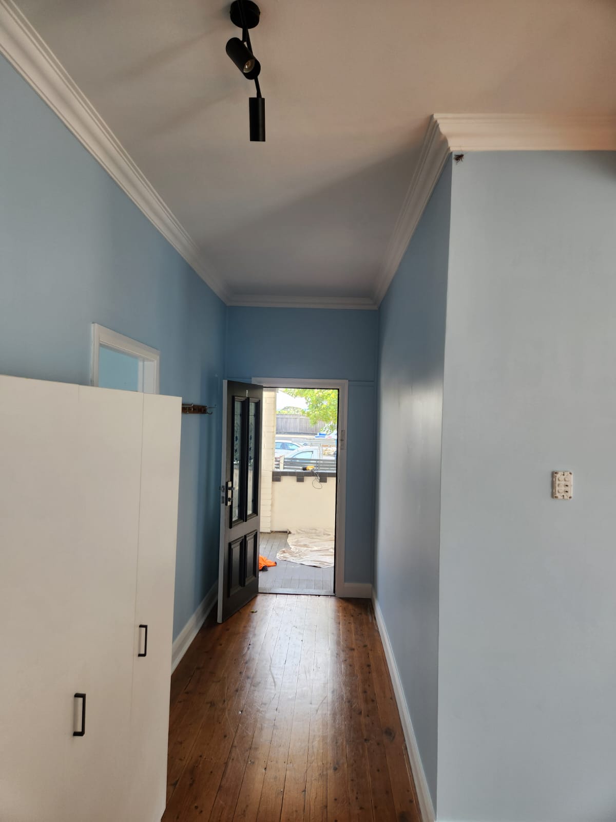 Freshly painted interior with coastal-blue walls in a Newcastle home