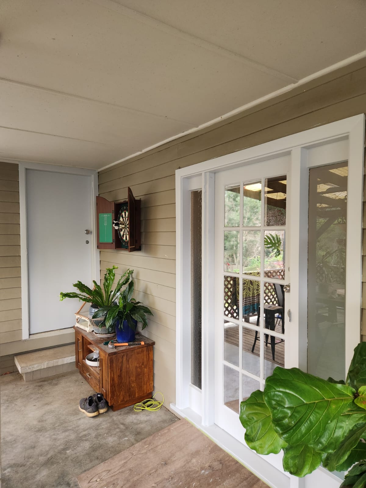 Painted French doors and trim on a covered porch