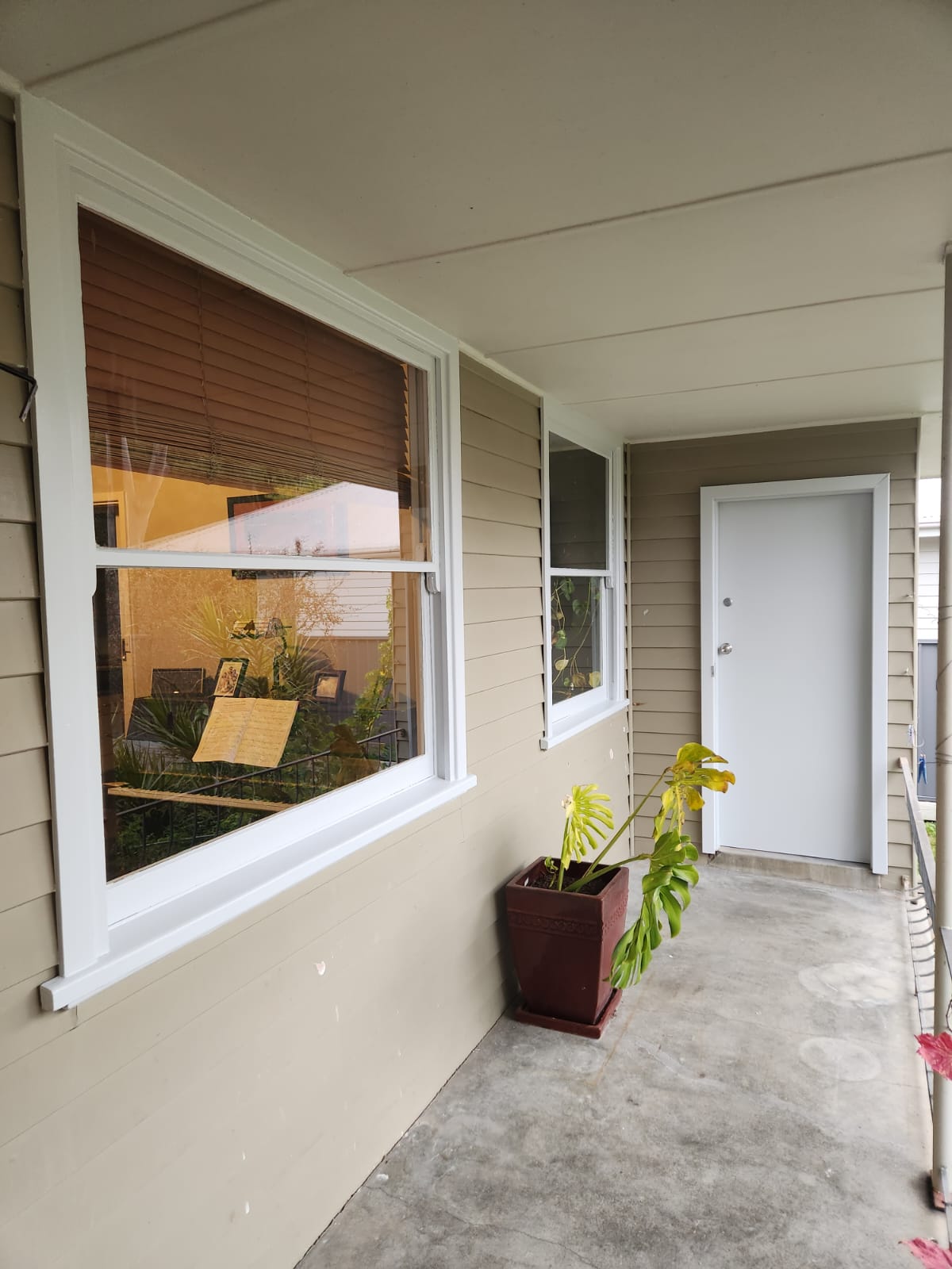 Front porch and entry door of a Newcastle home after painting