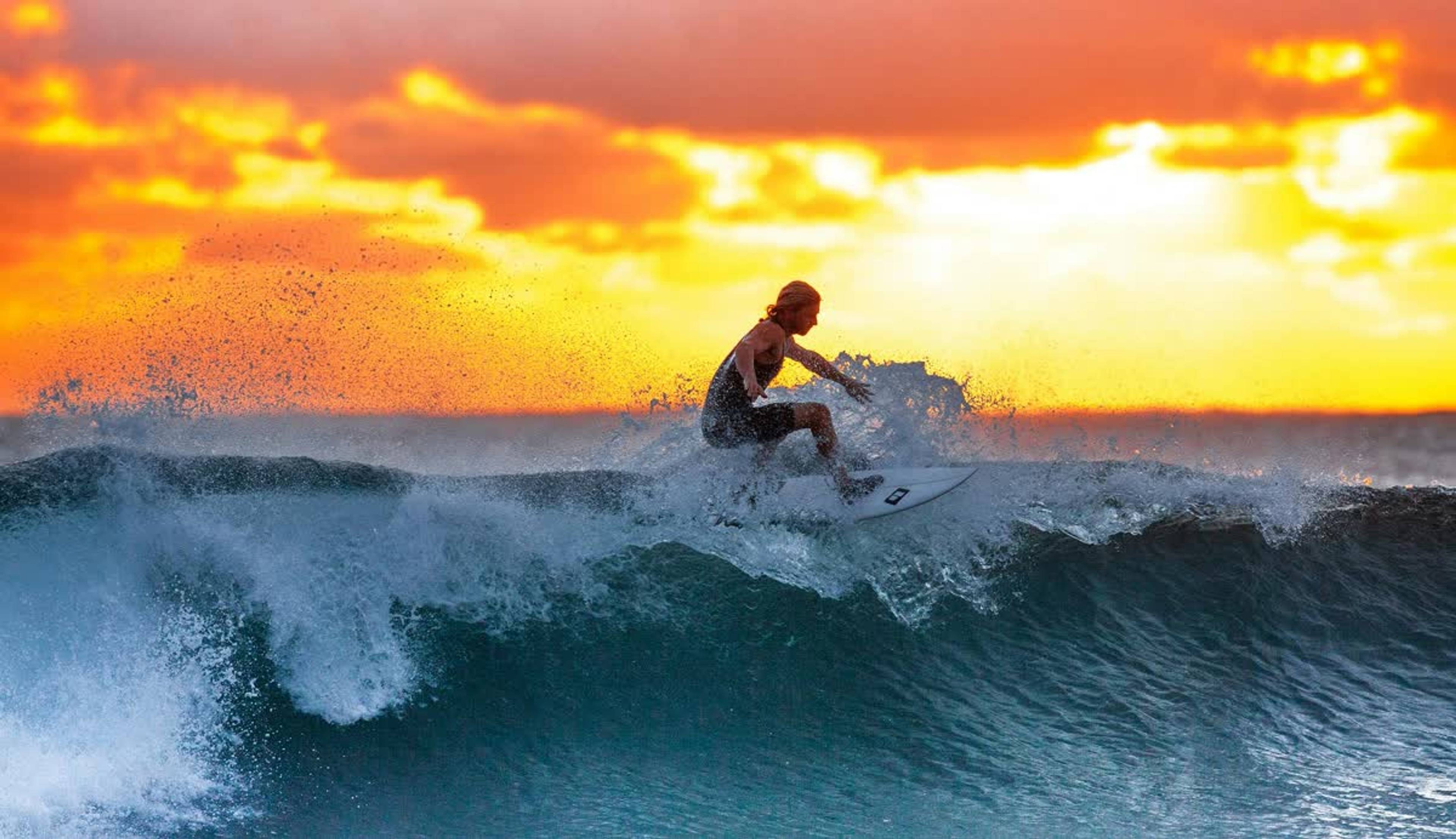 Surfer carving a clean Atlantic wave in Morocco