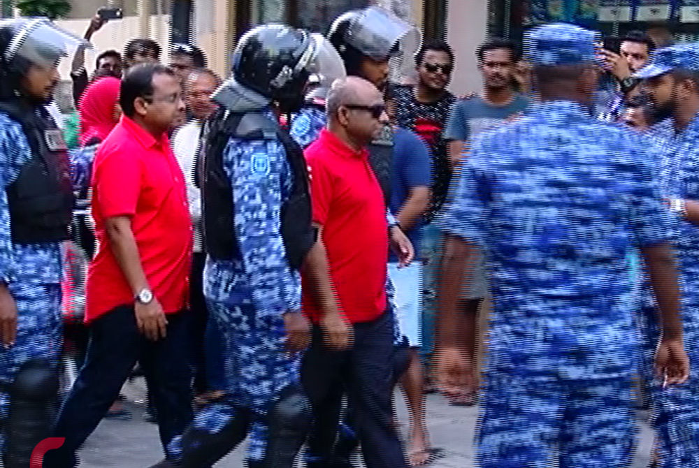 MP Abdulla Riyaz (L) and MP Abdulla Shahid (R) being taken into police custody on Friday