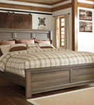 Signature Design by Ashley Juararo California King Panel Bed-Dark Brown