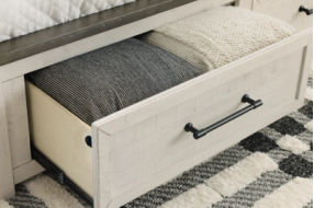 Benchcraft Brewgan California King Panel Storage Bed-Two-tone