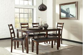 This dining room table set’s wonderfully clean-lined profile is dramatically enriched with a complex, burnished finish loaded with tonal variation and rustically refined character.