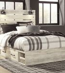 Signature Design by Ashley Cambeck Queen Panel Bed with Storage - Sample Room View