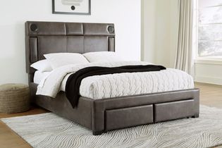 Signature Design by Ashley Mirlenz King Storage Bed with Speakers - Sample Room View