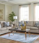 Signature Design by Ashley Deltona-Parchment Sofa and Loveseat - Sample Room View