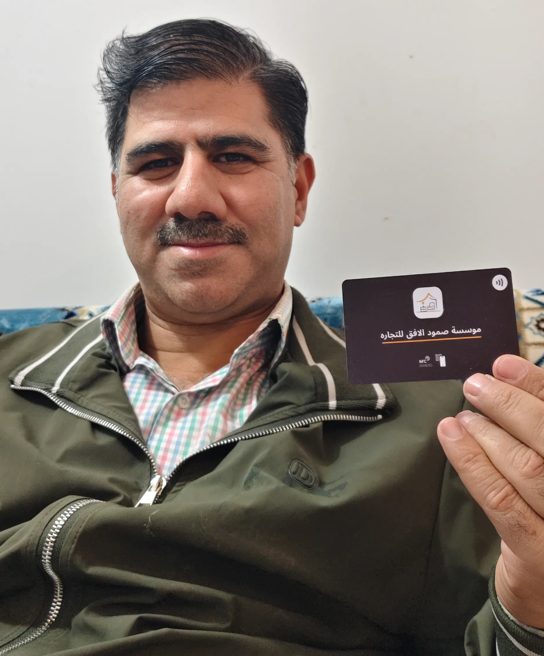 Client holding card 6