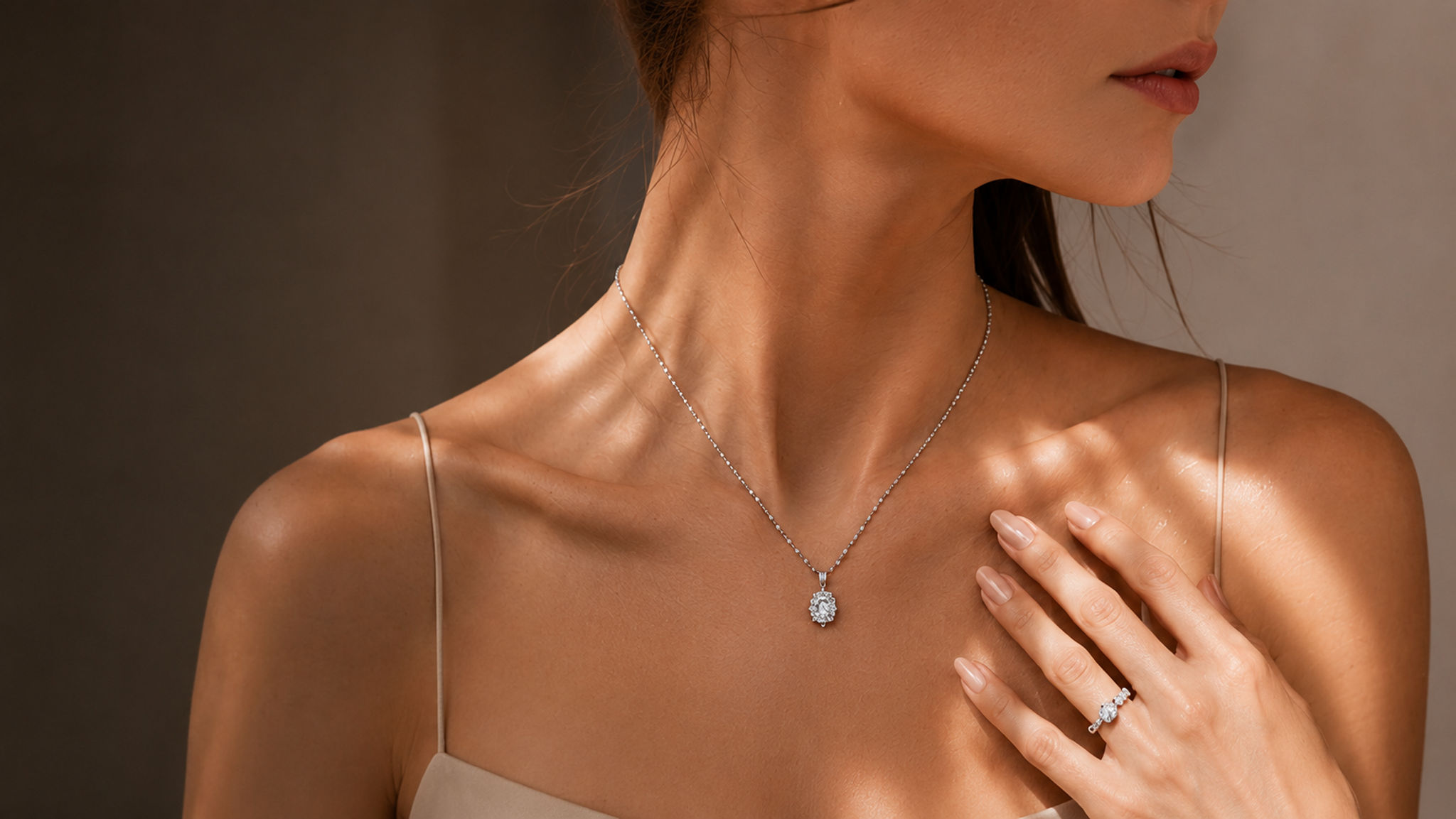 A diamond pendant and ring worn together